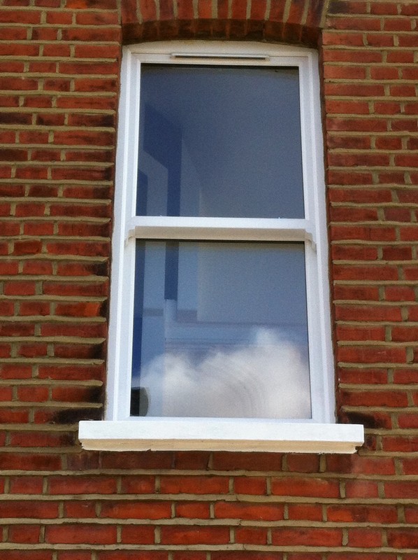 uPVC sash window on Victorian red brick house in Hayes